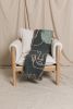 The LINEFACES Knitted Throw Blanket | Modern Art Decor | Linens & Bedding by Parker Heath | PAR  KER made. Item composed of cotton and fiber in boho or minimalism style