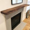 Live edge wood fireplace mantle shelf | Shelving in Storage by Ironscustomwood