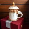 Elephant Mug with Lid & Saucer: Hand-Painted, Gold Accents | Drinkware by Artisan Homeware. Item made of ceramic