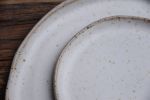 Set of 4 speckled white irregular plates, handmade handcraft | Dinnerware by Laima Ceramics. Item composed of stoneware in rustic style