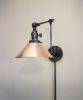 Plug in Swing Arm Adjustable Wall Light - Industrial Sconce | Sconces by Retro Steam Works. Item made of brass works with industrial style