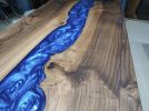 Dark Walnut Wood Metallic Blue River Epoxy Resin Dining | Dining Table in Tables by LuxuryEpoxyFurniture. Item made of wood with synthetic
