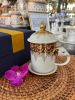 Elephant Mug with Lid & Saucer: Hand-Painted, Gold Accents | Drinkware by Artisan Homeware. Item made of ceramic