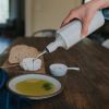Elixir Porcelain Olive Oil Dispenser | Jar in Vessels & Containers by The Bright Angle. Item made of ceramic