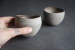 STC cup "Shell" -organic natural shape stoneware in grey | Drinkware by Laima Ceramics. Item composed of stoneware in minimalism style