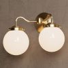 Norwood | Sconces by Illuminate Vintage. Item made of brass & glass