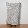 Peel Reversible Throw | Smoke/milk | Linens & Bedding by Jill Malek Wallpaper. Item made of cotton