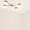 Celeste Aurora | Chandeliers by DESIGN FOR MACHA. Item made of brass & glass