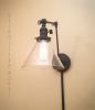 Plug in Swinging Adjustable Wall Light - Industrial Sconce | Sconces by Retro Steam Works. Item composed of metal and glass in industrial style