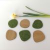 Oval shape green felt and Oak wood coasters. Set of 6 | Tableware by DecoMundo Home. Item composed of oak wood and fabric in minimalism or mid century modern style