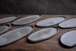 Organic natural shape elongated stoneware plates in grey | Dinnerware by Laima Ceramics. Item made of stoneware works with minimalism & contemporary style