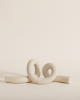 Ollis Knot, Bone | Sculptures by SIN. Item composed of stoneware