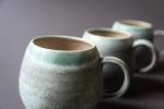 Turquoise  tea/coffee cup mug, white, handmade wheel thrown | Drinkware by Laima Ceramics. Item composed of stoneware compatible with minimalism style