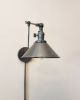 Plug in Swinging Adjustable Wall Light - Industrial Sconce | Sconces by Retro Steam Works. Item composed of metal compatible with industrial style