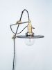 Raw Steel and Brass Industrial Scissor Wall Lamp | Sconces by Retro Steam Works. Item composed of metal in industrial style