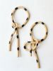 Clay Object 44- Black Polka Dots Long Side Bow | Sculptures by OBJECT-MATTER / O-M ceramics