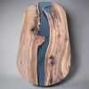 Oval epoxy river dining table | Tables by Ironscustomwood. Item made of walnut