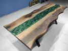 Live Edge Metallic Green  Walnut Tree Epoxy Resin Table | Dining Table in Tables by LuxuryEpoxyFurniture. Item composed of walnut and synthetic