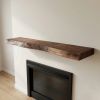 Live edge wood fireplace mantle shelf | Shelving in Storage by Ironscustomwood