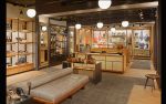 Perimeter Shelving System | Storage by Amuneal | Cole Haan in New York. Item composed of wood and metal