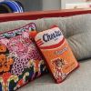 last one - velvet CHEETOS pillow custom made | Pillows by Mommani Threads. Item compatible with contemporary and eclectic & maximalism style