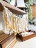 Hand-Ripped Fabric Tassel Garland | Tapestry in Wall Hangings by Over the Knotted Moon. Item made of fabric