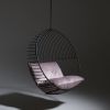 Half Circle Stand with Bubble at WMC Fair | Swing Chair in Chairs by Studio Stirling. Item made of steel works with minimalism & contemporary style