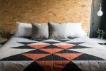 Antwerp Quilt | Linens & Bedding by Vacilando Studios | Private Residence, Neskowin in Neskowin. Item composed of cotton