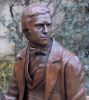 Young Darwin Statue | Public Sculptures by Anthony Smith Sculpture | Christ's College Cambridge in Cambridge. Item composed of bronze and stone