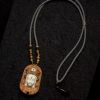 Carved Sandalwood & Deer Horn Deity Amulet Art | Ornament in Decorative Objects by Dynasty Artisan. Item made of wood works with contemporary & eclectic & maximalism style
