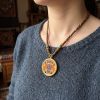 Zhaji Lhamo Thangka Gold Pendant Wealth Guardian Amulet | Ornament in Decorative Objects by Dynasty Artisan. Item composed of metal in contemporary or eclectic & maximalism style