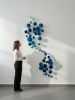 Blue cascade of circular epoxy resin sculpturar element | Mixed Media by Wall Art Object by Betti Brillembourg