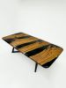 Black Olive Wood Epoxy Resin River Dinner Table - Live Edge | Dining Table in Tables by Tinella Collection. Item composed of wood & brass compatible with minimalism and art deco style