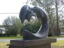 Dolphin Family | Public Sculptures by Jim Sardonis | Fairhope in Fairhope. Item made of bronze with stone