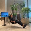 Minimal Hanging Sling Chair in the Sanctury Japan | Hammock in Chairs by Studio Stirling | Roppongi Hills in Minato City. Item made of steel with leather works with boho & minimalism style