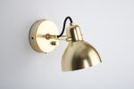 Laito Mini Wall Sconce | Sconces by SEED Design USA. Item composed of steel