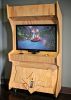 Custom Wood Arcade | Media Console in Storage by Monkwood Studios | The Vault in Orange. Item made of wood