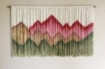 SIERRA PINK Dyed Wall Tapestry Mountain Landscape | Macrame Wall Hanging in Wall Hangings by Wallflowers Hanging Art. Item composed of oak wood & fiber compatible with boho and country & farmhouse style