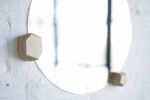 Round Wall Mirror With Geometric Hardwood Knobs | Decorative Objects by THE IRON ROOTS DESIGNS. Item composed of glass