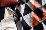 Antwerp Quilt | Linens & Bedding by Vacilando Studios | Private Residence, Neskowin in Neskowin. Item composed of cotton