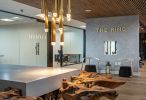 Teak and Concrete Reception Desk | Tables by Béton Studio | The Ring Workspaces in Clearwater. Item made of cement