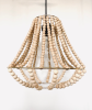 Wood Bead Light Fixture | Chandeliers by Lisa Haines. Item made of wood works with boho style
