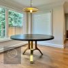 Charcoal walnut brass tripod wishbone table | Dining Table in Tables by YJ Interiors. Item made of oak wood & brass compatible with mid century modern and eclectic & maximalism style