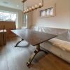 Charcoal Walnut Bronze Wishbone Table | Dining Table in Tables by YJ Interiors. Item composed of walnut and brass in mid century modern or contemporary style