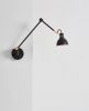 Laito Gentle Wall Sconce | Sconces by SEED Design USA. Item made of steel