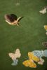 Spirit in the Sky rug. Butterflies on green background | Small Rug in Rugs by Sergio Mannino Studio. Item composed of fabric