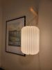 wall sconce + long lantern | Sconces by Studio Pleat. Item composed of wood and paper in minimalism or mid century modern style