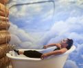 Airbnb Mural: Cloud Sky Mural behind Bathtub | Murals by Devona Stimpson. Item made of synthetic