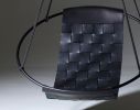 Genuine Leather Woven into a Hanging Swing Chair | Accent Chair in Chairs by Studio Stirling. Item made of steel & leather compatible with boho and minimalism style