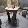 Organic hand sculpted table in black ceramic | Side Table in Tables by Ingrid Vermulst by Studio Wild Orange | CASA DECOR 2026 in Madrid. Item composed of stoneware in contemporary or japandi style